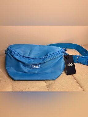 “The Foldie” blue crossbody bag- NWT